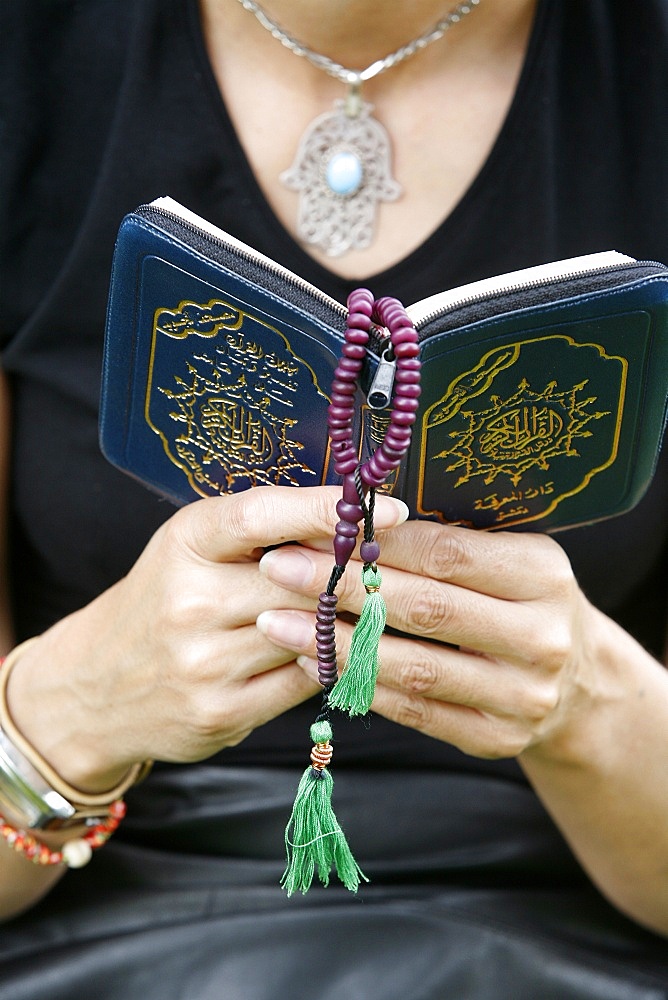 Woman reading the Koran