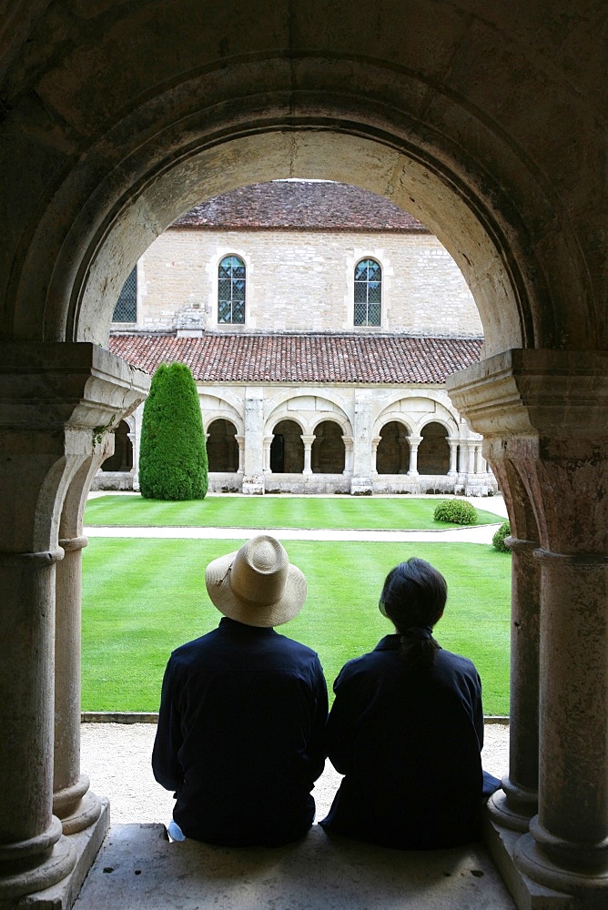 Tourists in Fontenay Cistercian Abbey cloister, UNESCO World Heritage Site, Marmagne, Doubs, Burgundy, France, Europe