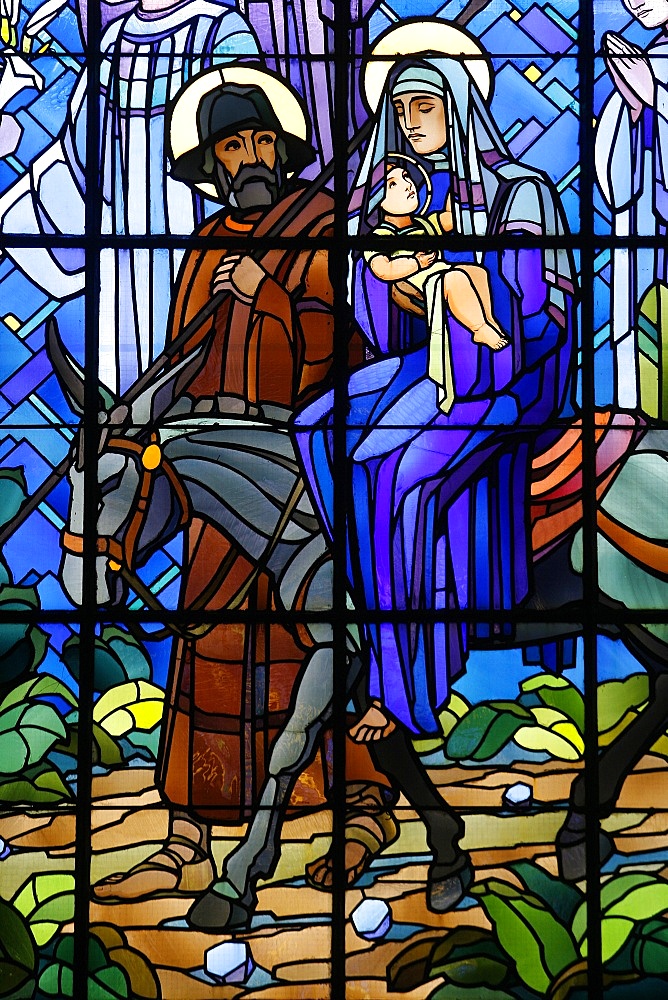 Stained glass window of the Flight into Egypt, in Chedde church, Haute Savoie, France, Europe