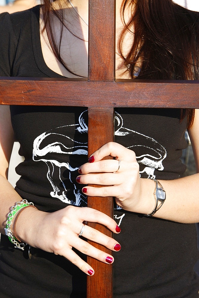 Young Catholic girl with a cross, Sydney, New South Wales, Australia, Pacific