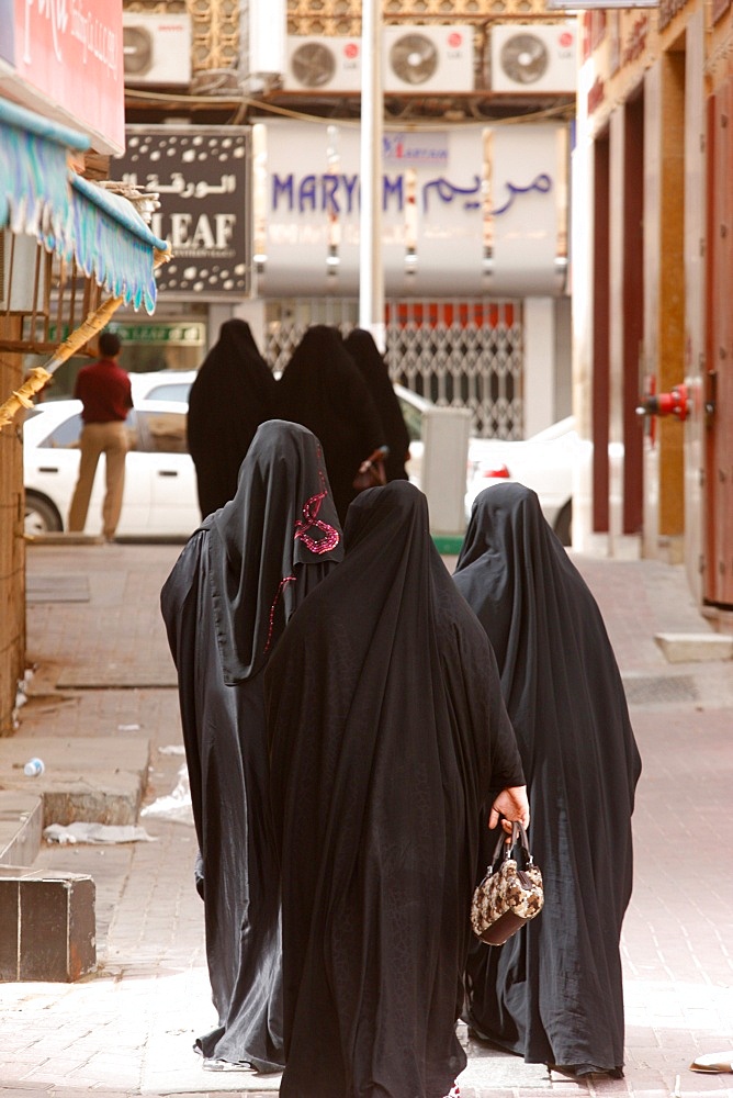 Muslim women wearing abayas, Dubai, United Arab Emirates, Middle East