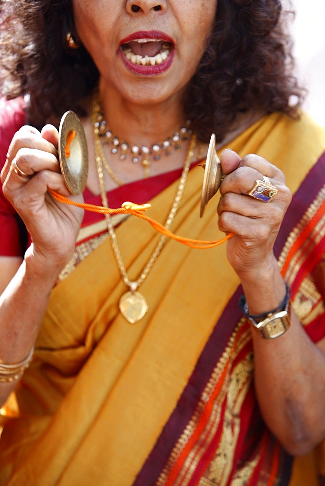 Devotee singing and playing cymbals, Chariot Festival, London, England, United Kingdom, Europe