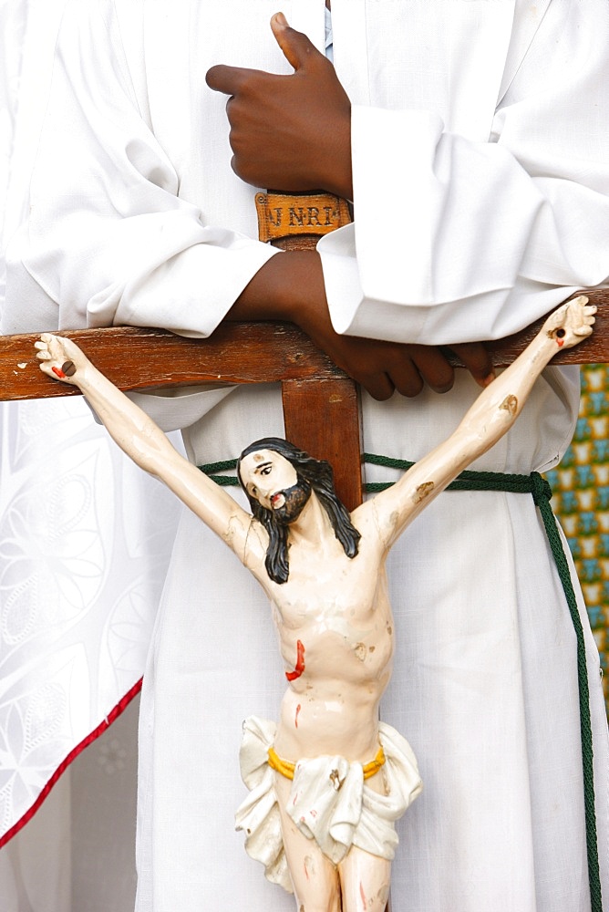 Altar boy holding a crucifix, Lome, Togo, West Africa, AFrica