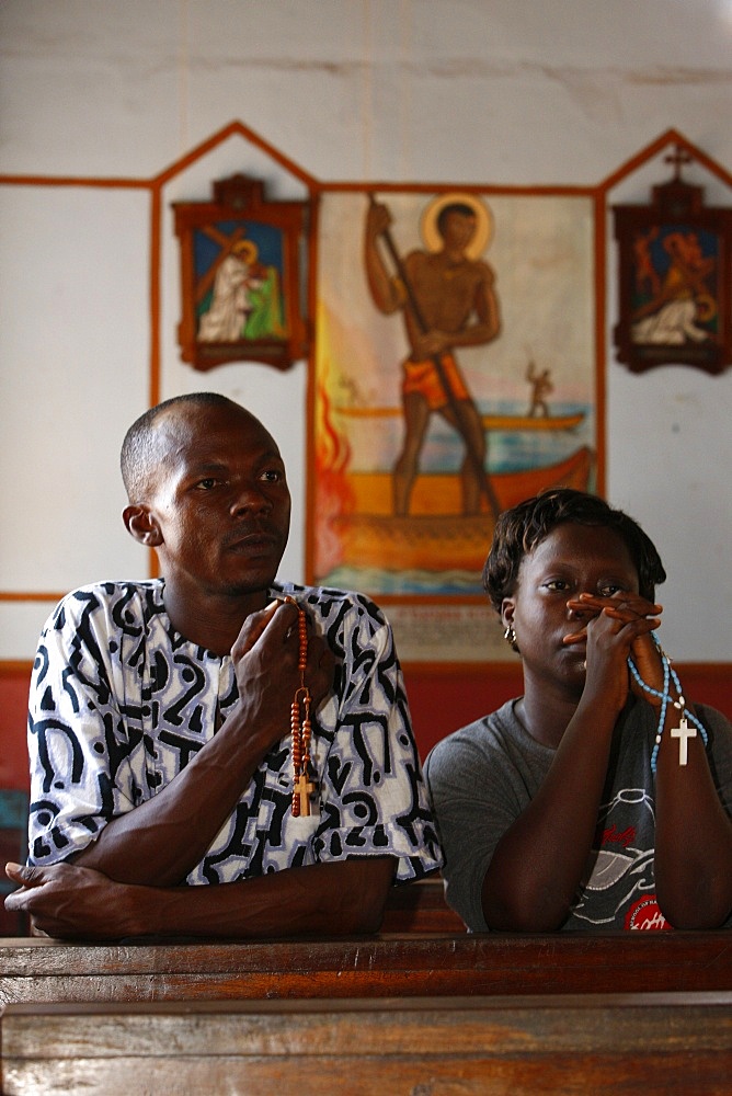 Christian couple praying, Togoville, Togo, West Africa, Africa