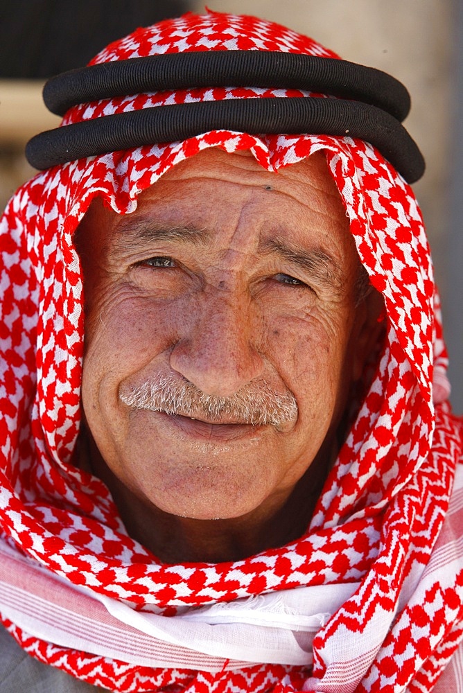 Old Jordanian man wearing a keffiyah scarf, Petra, Jordan, Middle East