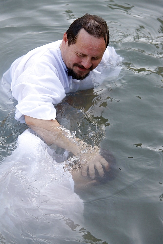 Pilgrim's baptism in the Jordan River, Yardenit, Israel, Middle East