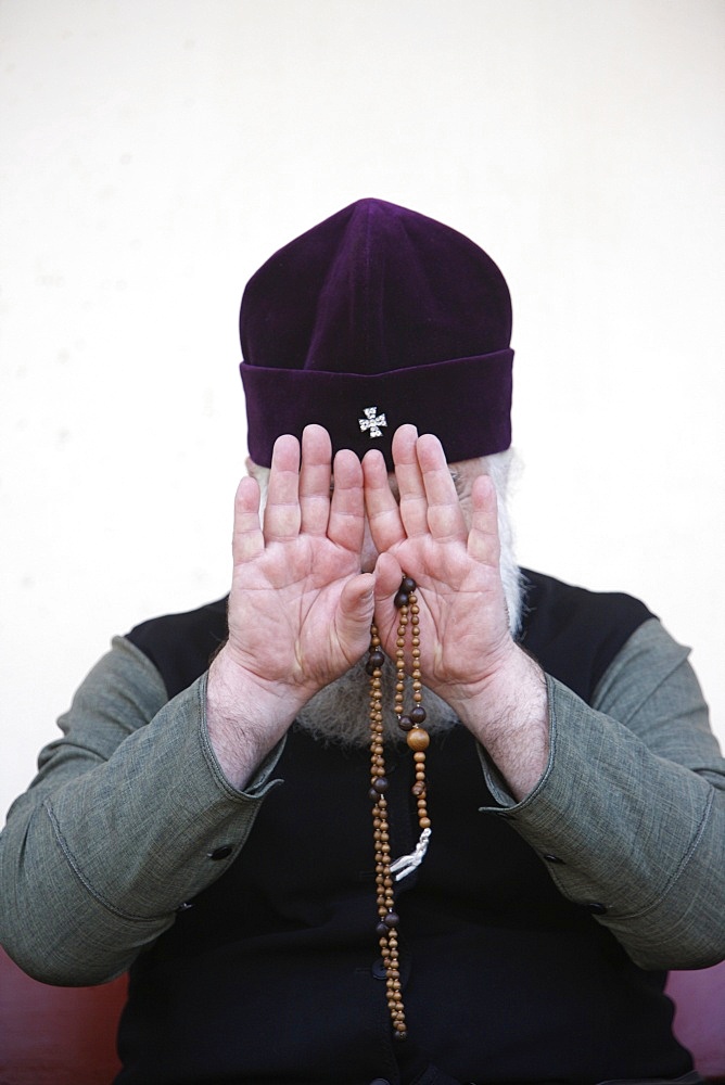 Camera-shy Orthodox priest, Yardenit, Israel, Middle East