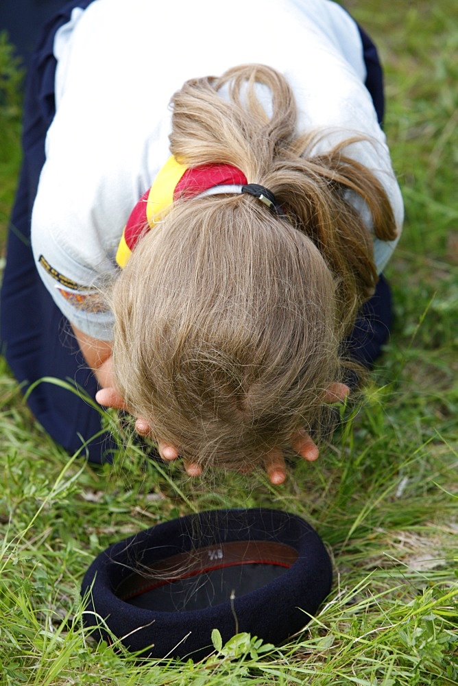 Girl Scout praying, traditionalist Catholic pilgrimage, Gas, Eure-et-Loir, France, Europe