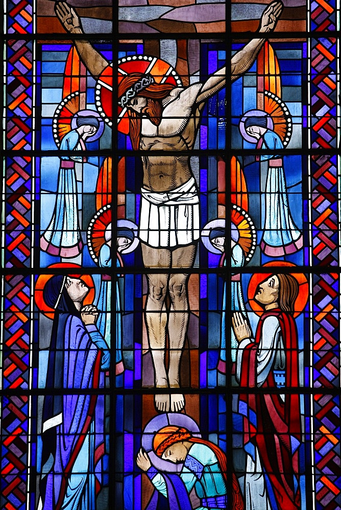 Stained glass of the Crucifixion in Notre Dame du Rosaire Catholic church, Saint-Ouen, Seine-Saint-Denis, France, Europe