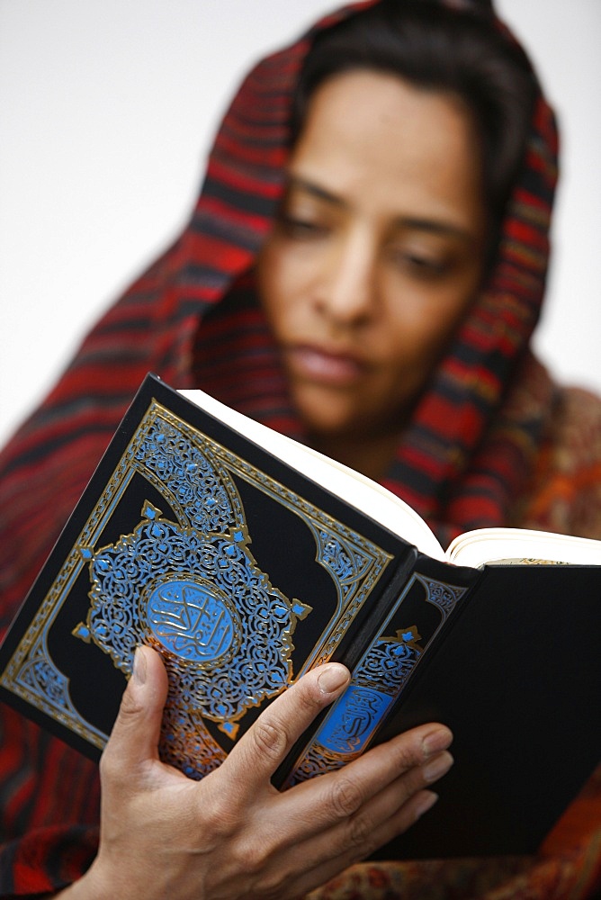 Woman reading Koran, Jordan, Middle East