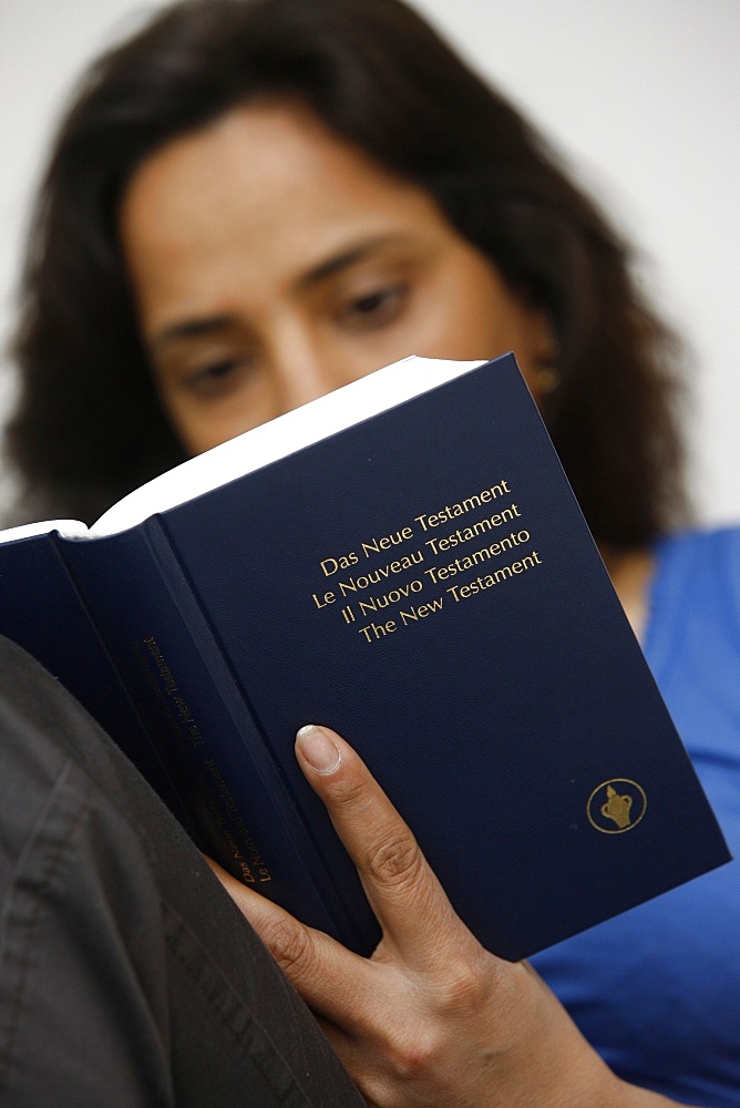 Woman reading a Bible, Jordan, Middle East