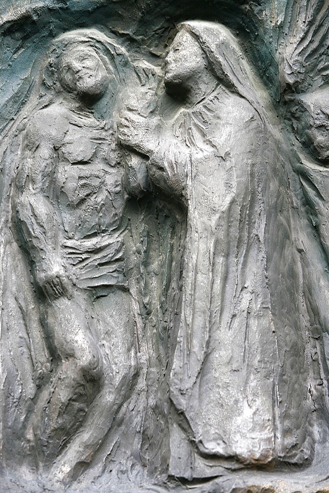 Sculpture of Jesus taken down from the cross, on the Notre Dame door, Saint-Pierre de Montmartre church, Paris, France, Europe