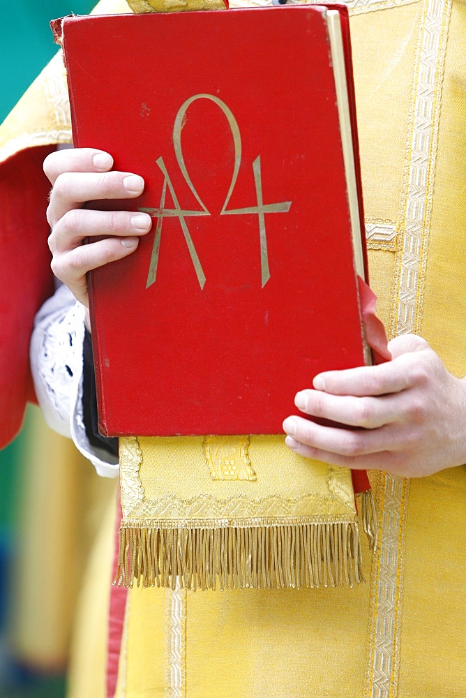 New Testament in Latin at a traditionalist Catholic pilgrimage, Villepreux, Yvelines, France, Europe