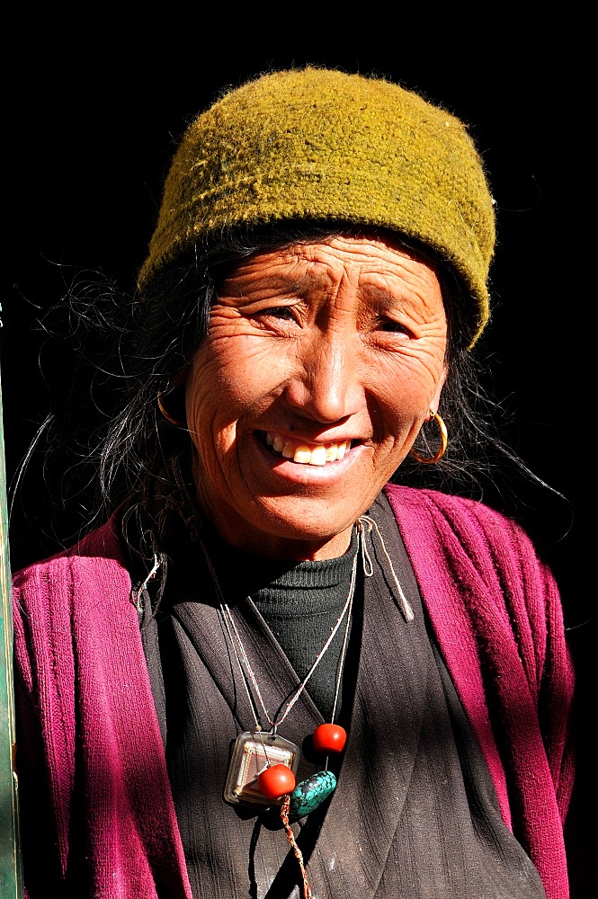 Mustang woman in Tsarang village, Mustang, Nepal, Asia