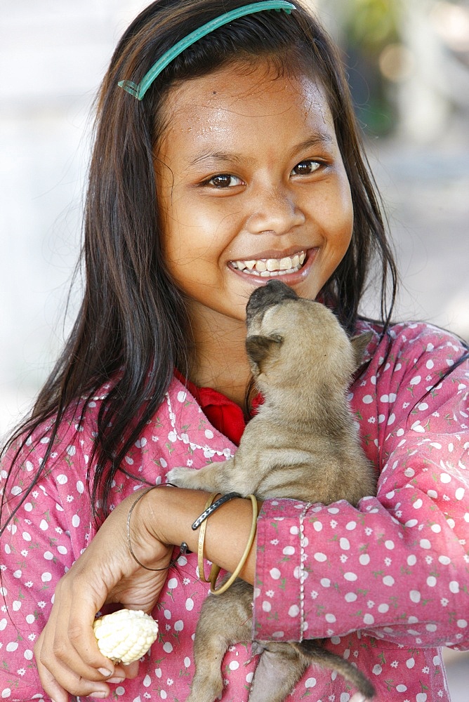 Young Cambodian girl and her little dog, Siem Reap, Cambodia, Indochina, Southeast Asia, Asia