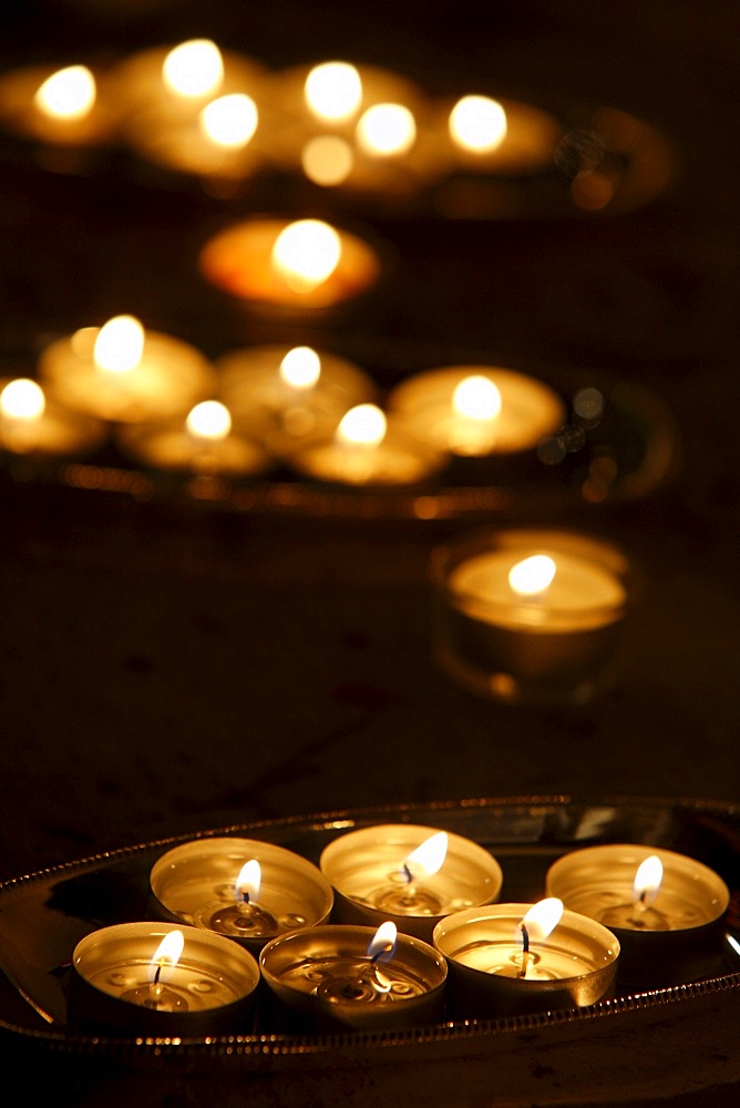 Candle offering for Wesak celebrating Buddha's birthday, awakening and Nirvana, Great Buddhist Temple (Grande Pagode de Vincennes), Paris, France, Europe