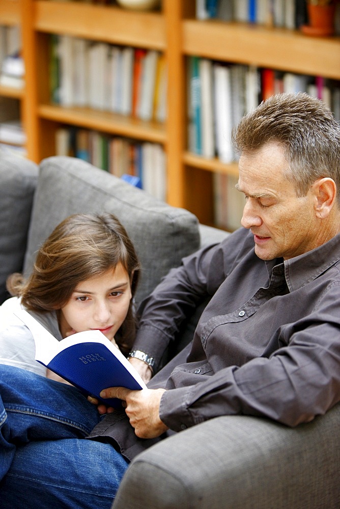 Reading the Bible at home, Paris, France, Europe