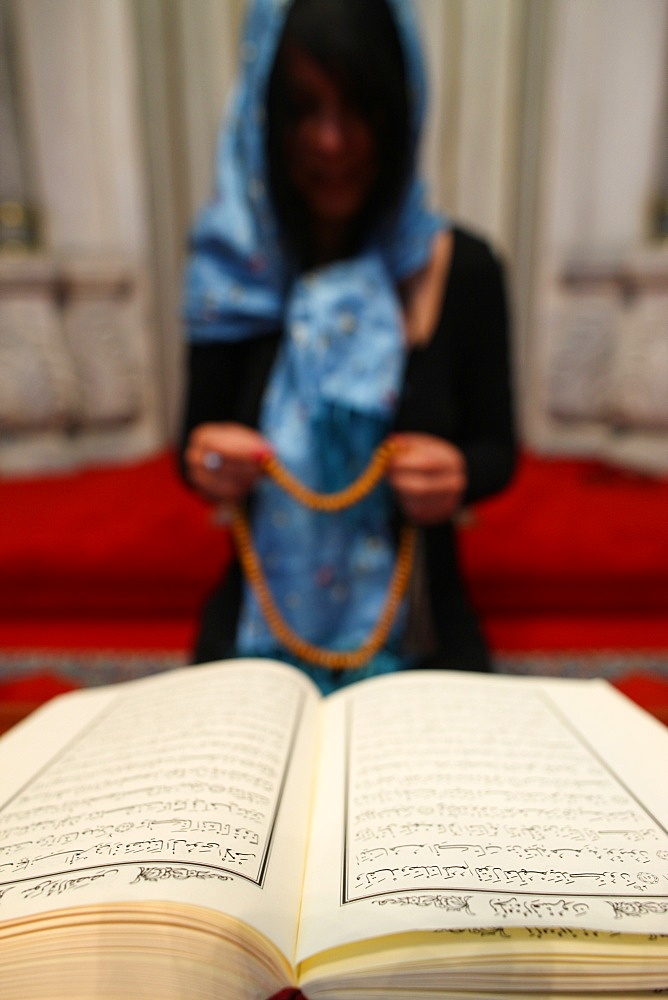 Woman praying in a mosque, Istanbul, Turkey, Europe