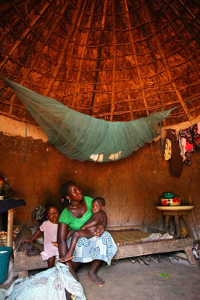 Woman and children in an African hut, Tori, Benin, West Africa, Africa