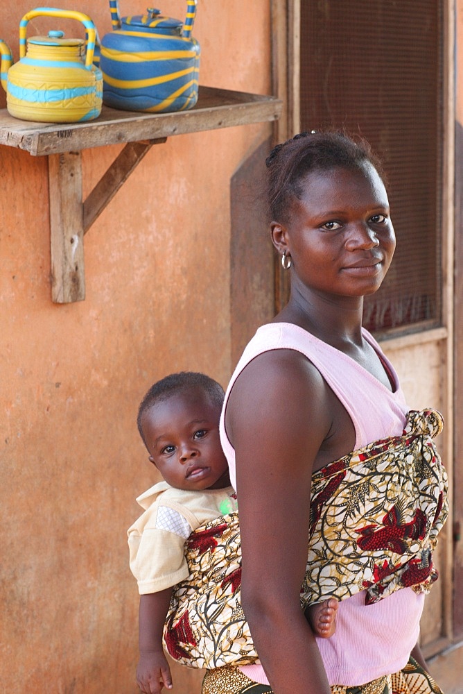 African woman carrying her baby on her back, Lome, Togo, West Africa, Africa