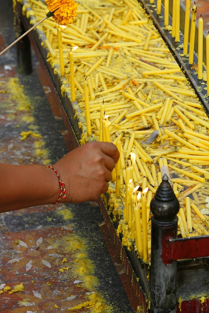 Lighting a candle in Doi Suthep, Chiang Mai, Thailand, Southeast Asia, Asia