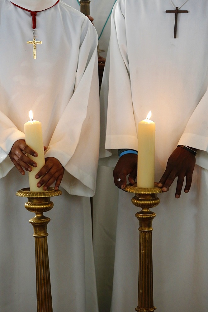 Catholic altar boys holding church candles, Seine-Saint-Denis, France, Europe