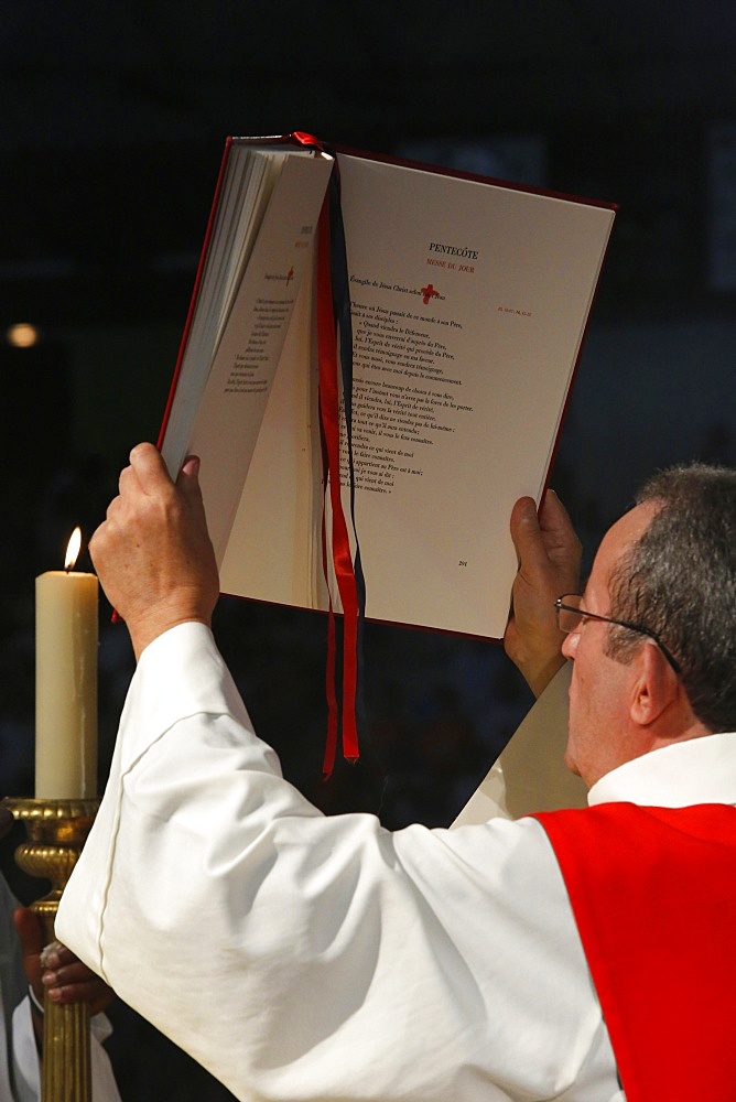 Deacon raising the Gospel, Catholic Mass, L'Ile St. Denis, France, Europe