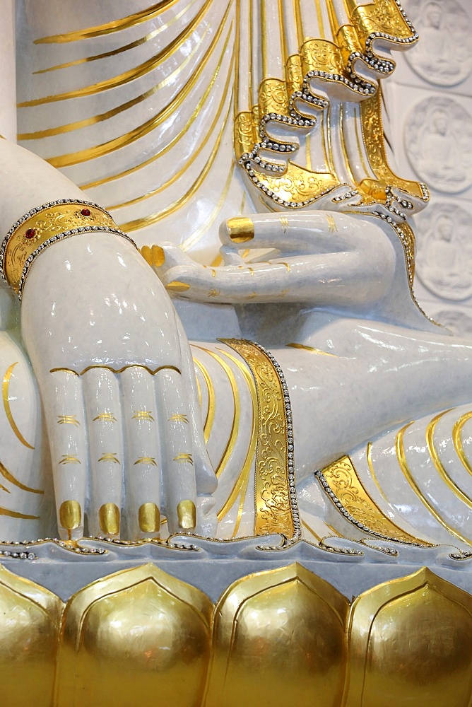 Detail of Buddha sitting in bhumisparsha-mudra posture (calling the earth to witness), Fo Guang Shan Temple, the largest Buddhist temple in Europe, Bussy-Saint-Georges, Seine-et-Marne, France, Europe