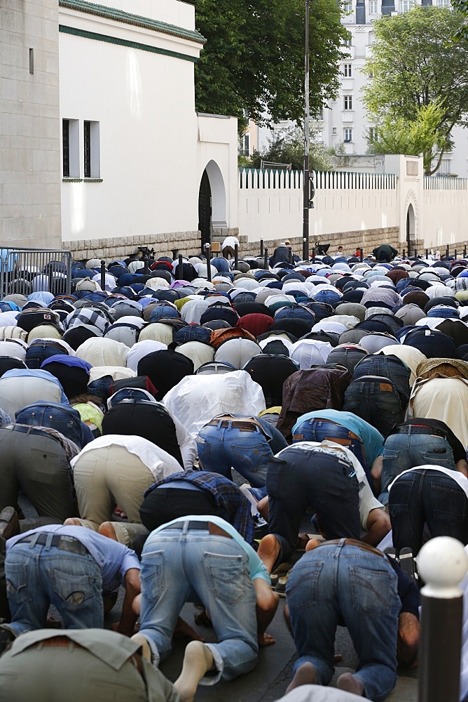 Muslims praying outside the Paris Great Mosque on Eid al-Fitr festival, Paris, France, Europe