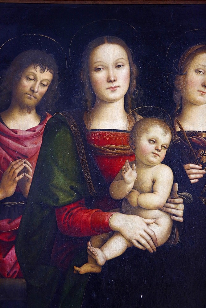 Virgin with child surrounded by St. John the baptist and St. Catherine by Pietro Vannucci painted in 1500, Paris, France, Europe