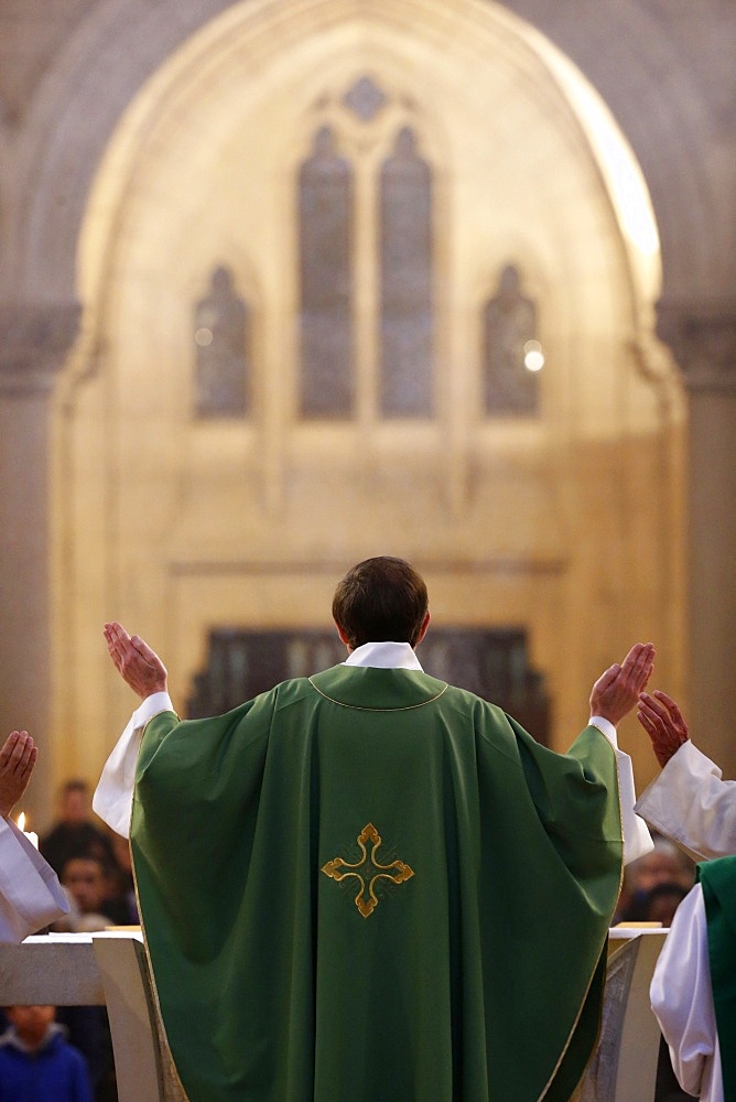 Eucharist, priest in Catholic Mass, Notre-Dame du Perpetuel Secours Basilica, Paris, France, Europe