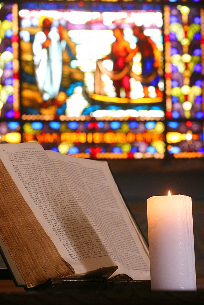 Old Bible and church candle, Carouge Protestant temple, Geneva, Switzerland, Europe