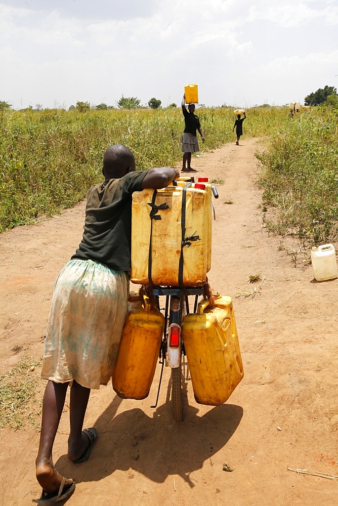 Water chore, Masindi, Uganda, Africa