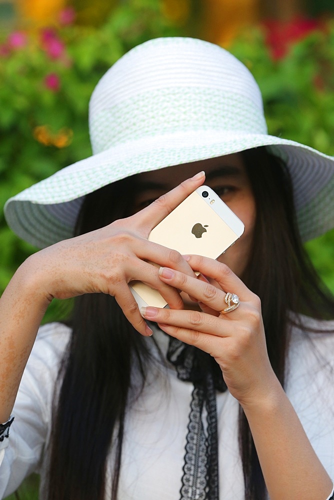 Woman taking picture with a smartphone, Vietnam, Indochina, Southeast Asia, Asia