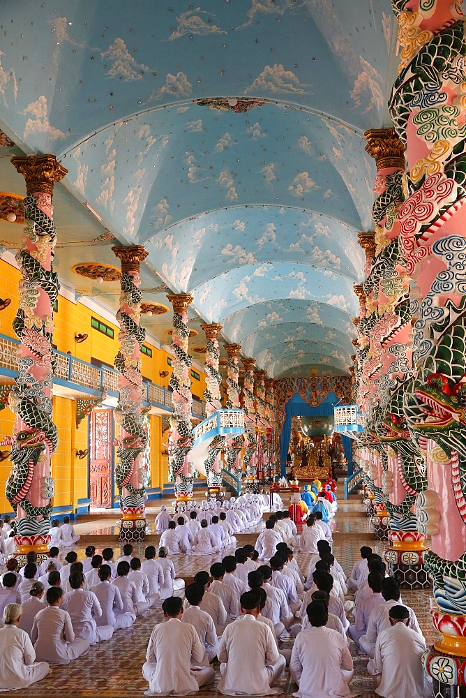 Praying devout men and women, ceremonial midday prayer, Cao Dai Holy See Temple, Tay Ninh, Vietnam, Indochina, Southeast Asia, Asia