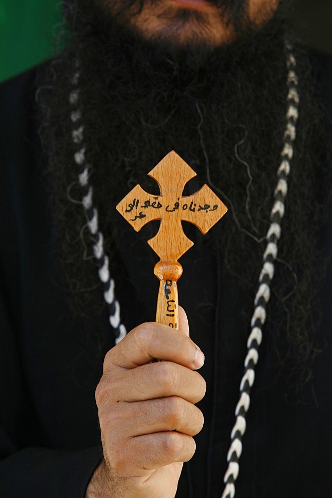 Egyptian Orthodox Coptic priest showing cross, Jerusalem, Israel, Middle East