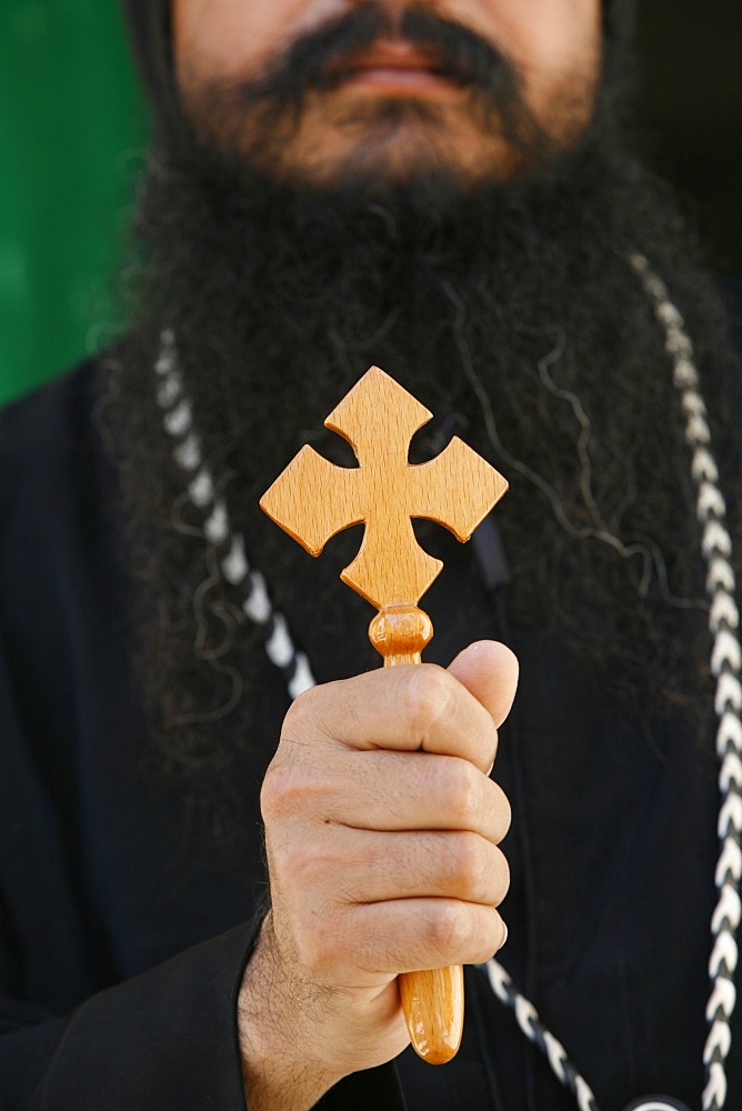 Egyptian Orthodox Coptic priest holding cross, Jerusalem, Israel, Middle East