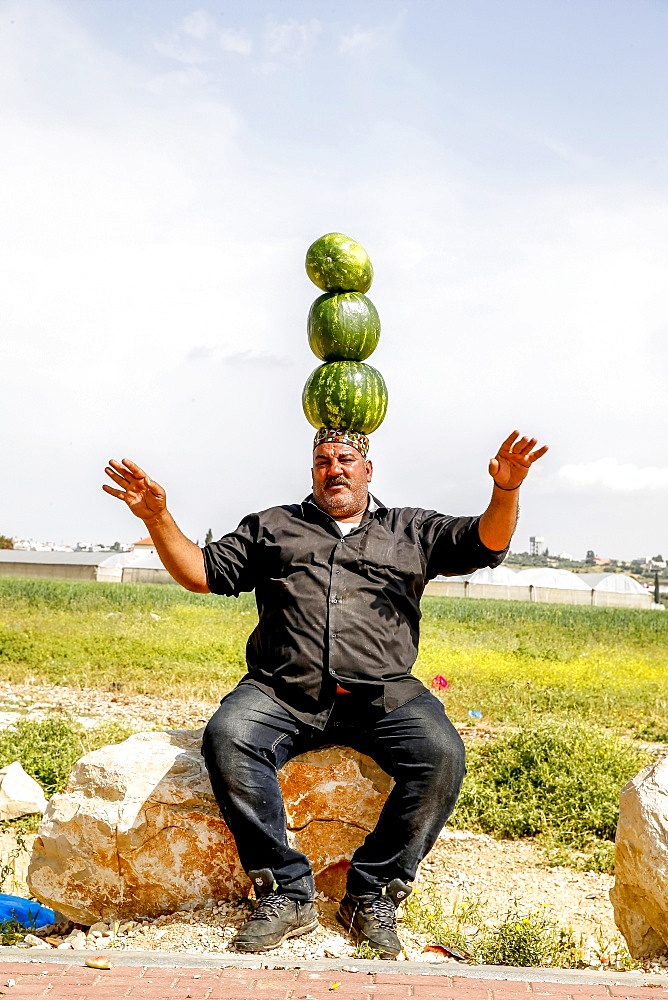 Palestinian selling watermelons at Al-Jalameh checkpoint on Israel-Palestine border, Palestine, Middle East