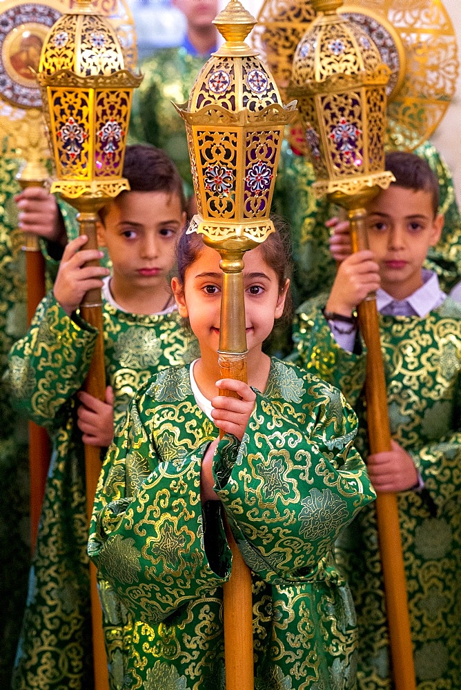 Altar boys and girls at Celebration of the Myrrh bearers' Sunday in the Nazareth Melkite (Greek Catholic) church, Galilee, Israel, Middle East