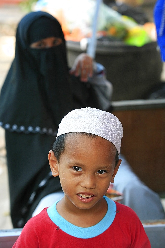 Young Muslim boy and his mother, Kuala Lumpur, Malaysia, Southeast Asia, Asia