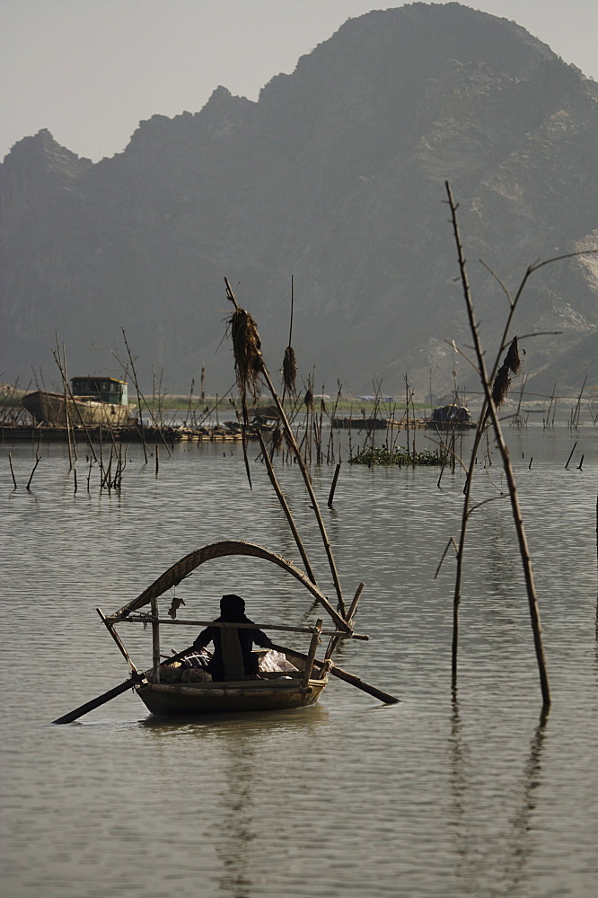 Woman rowing on Canal of Ken Ga,  Ninh Binh, Vietnam,  Indochina, Southeast Asia, Asia