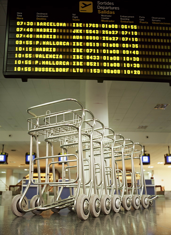 Baggage trolleys in departures area, Ibiza Airport, Spain, Europe