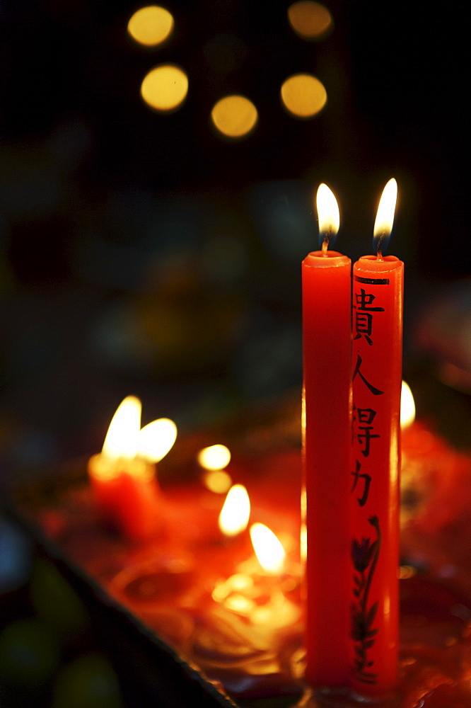 Candle offerings in Buddhist temple, Ho Chi Minh City, Vietnam, Indochina, Southeast Asia, Asia