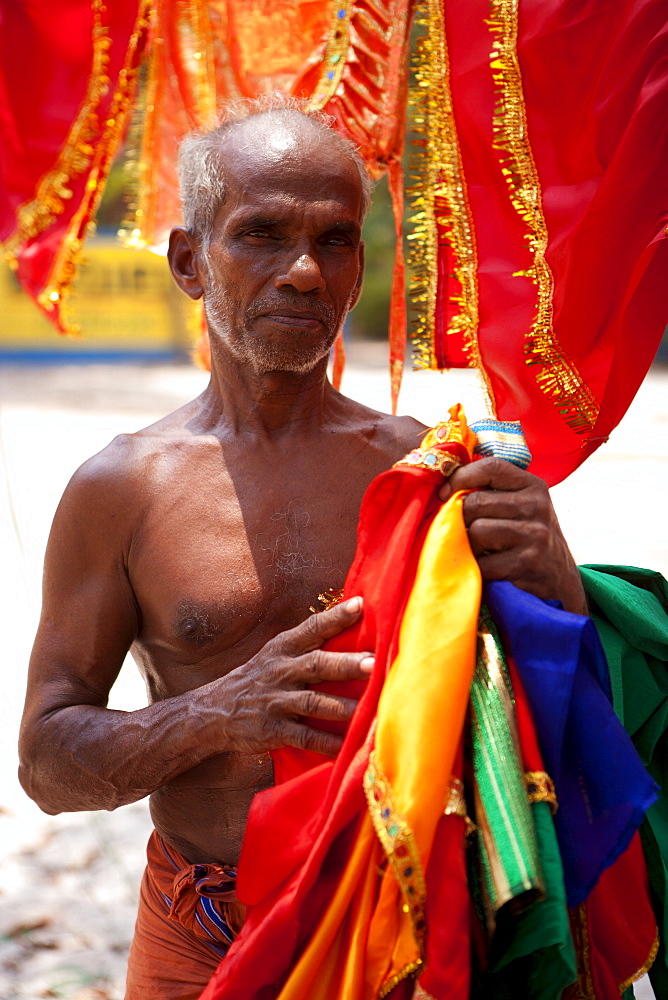 Man with temple decorations and bright fabrics, Kerala, India, Asia