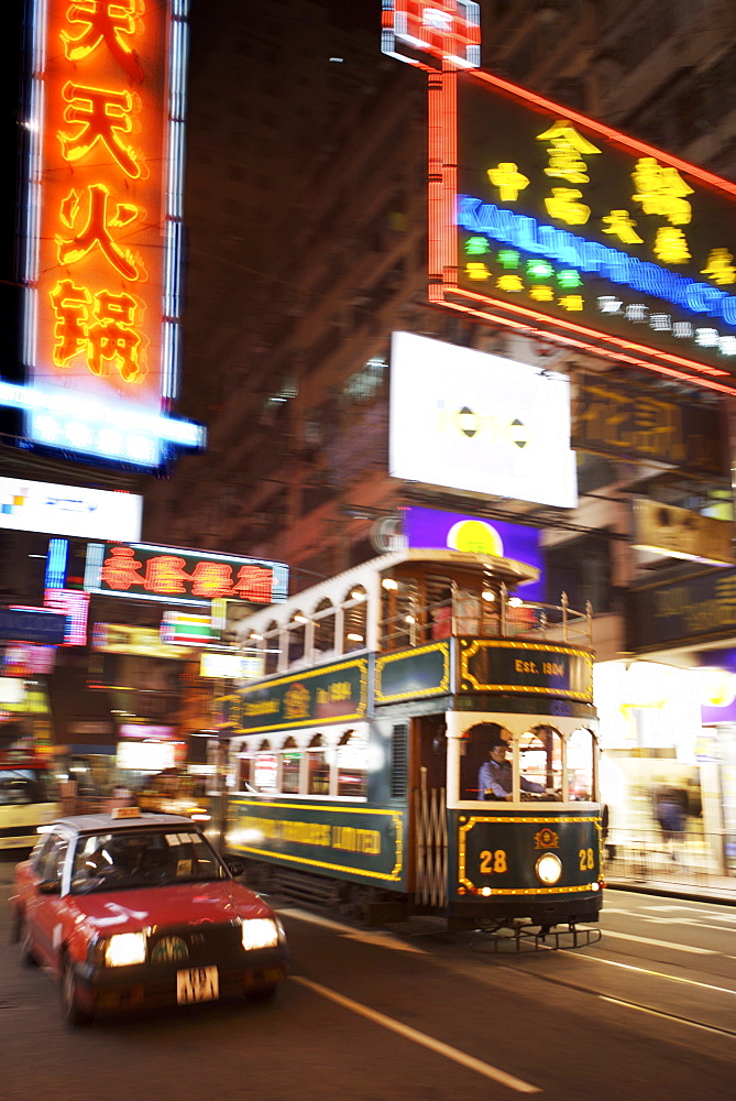 Tram and taxi with neon lights, Hong Kong, China, Asia