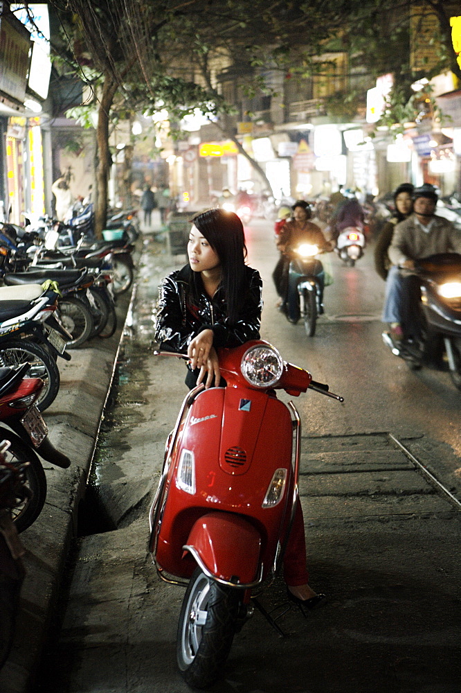 Girl sitting on red Vespa, Hanoi, Vietnam, Indochina, Southeast Asia, Asia