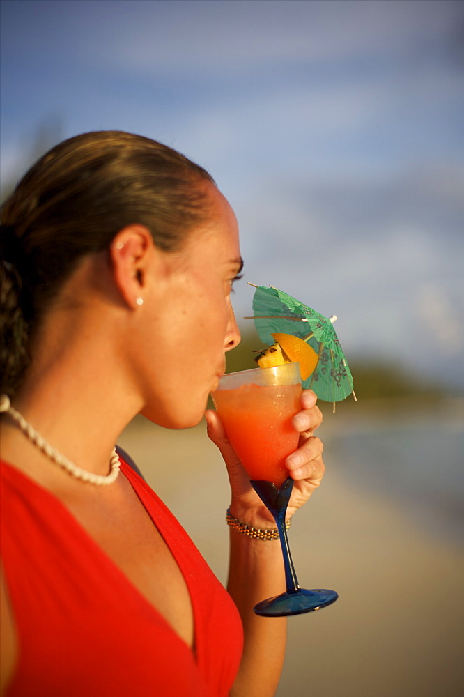 Sunset and cocktail on the Fernandez beach of Cat Island, Bahamas, West Indies, Caribbean, Central America