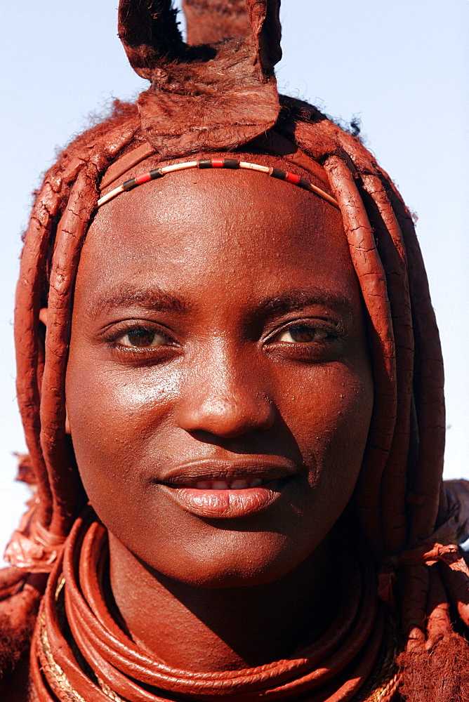 Young woman Himba in the area of Kunene river, on the border with Angola, Namibia, Africa