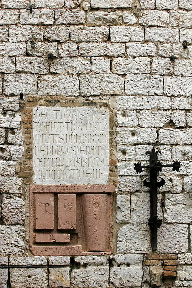 Property signs on the wall of an old house in Assisi, Umbria, Italy, Europe