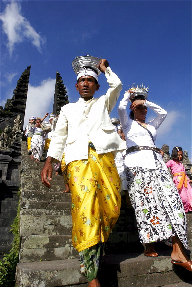 Man going down the stairs of the temple of Besakih, Bali, Indonesia, Southeast Asia, Asia